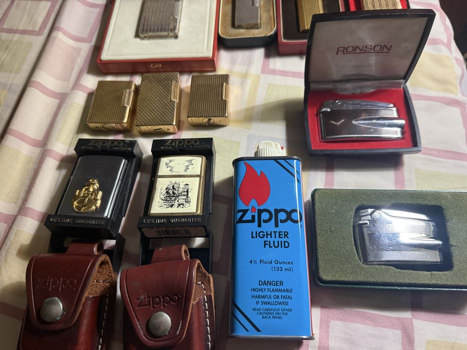 11 isqueiros 4 Dupont 1 Cartier 1 Dunhill 2 Ronson 2 Zippo 1 Zaima