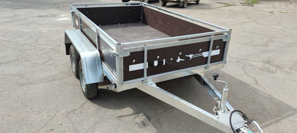 Прицеп двух осник, две оси, усиленный бортовой, оцинкованный Ursa,