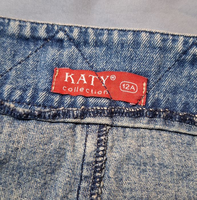 Saia de ganga c/ bordado e bolsos