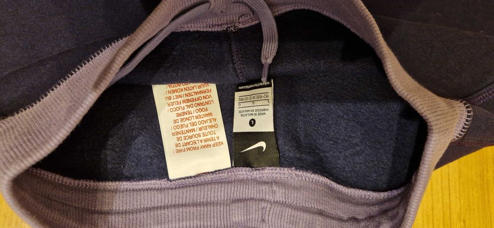 Ciepłe fioletowe spodnie dresowe Nike 152/158