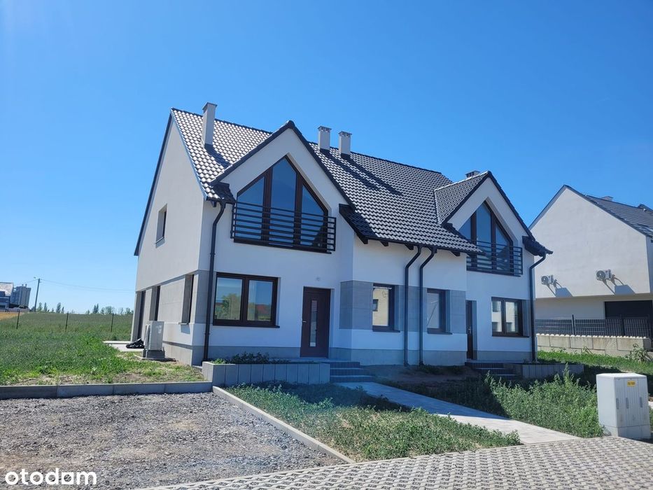 Ładny, kompaktowy, na dużej działce, oddany do użytku, dom bliźniak.