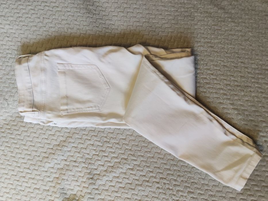 Białe jeansy damskie Orsay rozmiar 38
