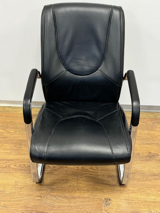 Black Armchair with Some Rust Marks