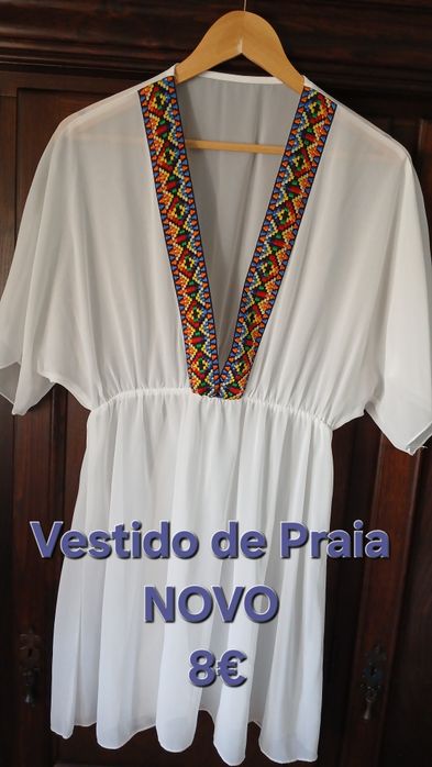 Saida de praia, branca com devote em v. Nova sem etiqueta.