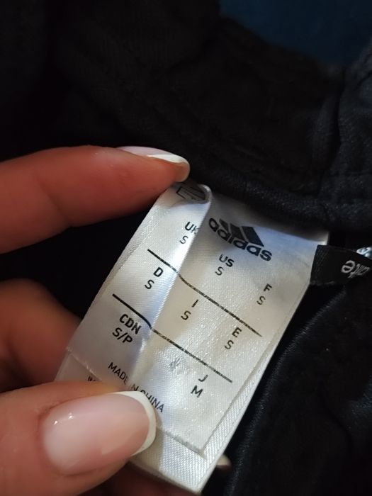 Dwie pary Adidas spodnie bramkarskie  S młodzieżowe i spodenki czarne