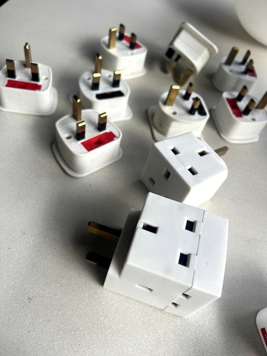 8 UK-to-European Plug Adapters and 2 UK Triple Sockets64751068444417121