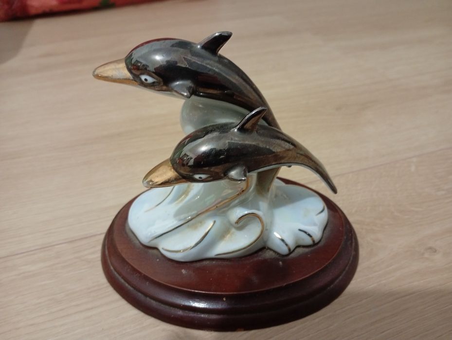 Porcelana golfinhos braco dourado