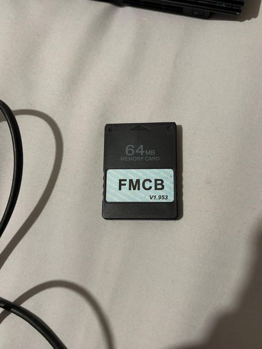 PS2 Slim com acessórios