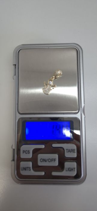 Złoty charms do bransoletki typu Pandora aniołek ,białe cyrkonie