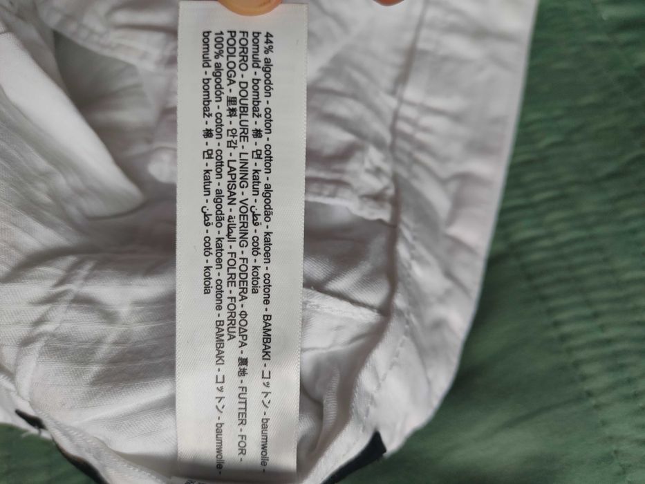 Lniane spodnie męskie Massimo Dutti w kolorze białym, idealne na lato.