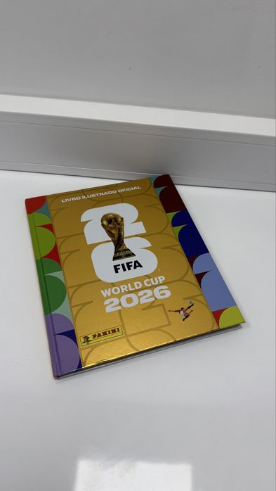 Caderneta mundial 2026 (capa dura), versao dourada