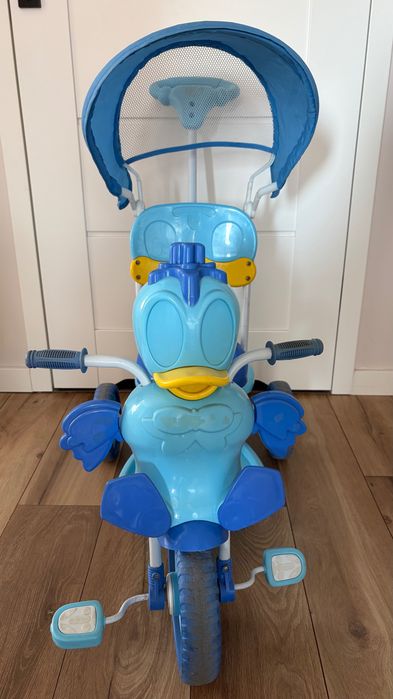 Rowerek trójkołowy błękitny Kaczor Donald z daszkiem i popychaczem