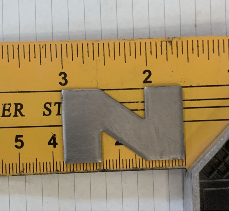 Металеві букви на поріг MAN