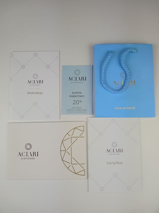 Złoty pierścionek z brylantem.