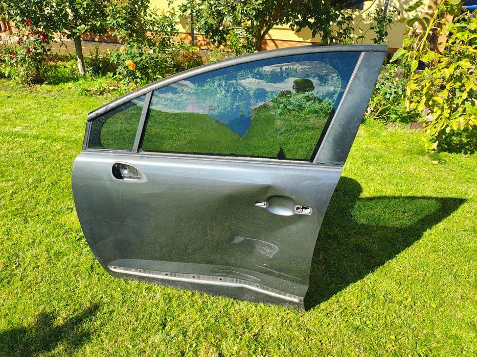 Дверка ліва (водійська ) Пежо 5008 2010