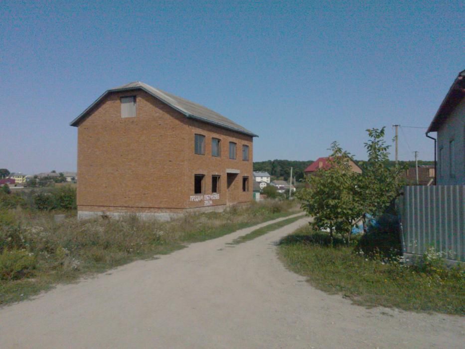 Земельна ділянка з Будинком