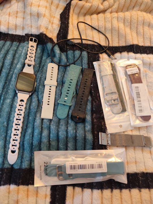 Braceletes e carregador smartwatch
