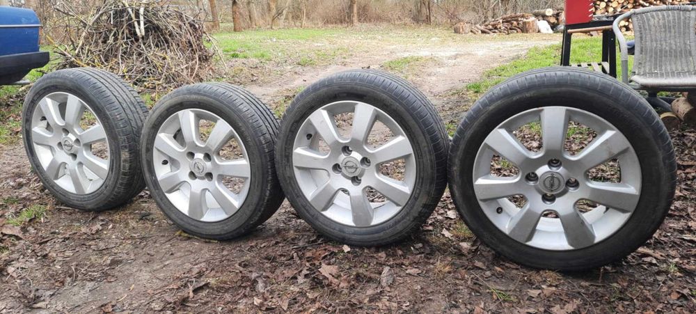 OPEL Felgi aluminiowe z oponami letnimi 15 cali.