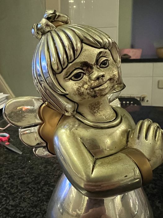 Vendo estátua banhada a prata