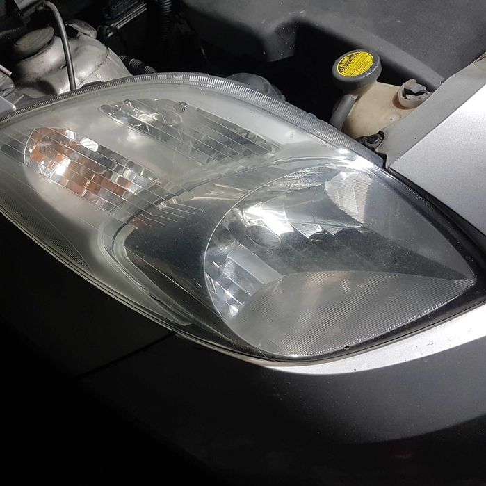lampa reflektor toyota yaris II 2 08r P9 oryginał