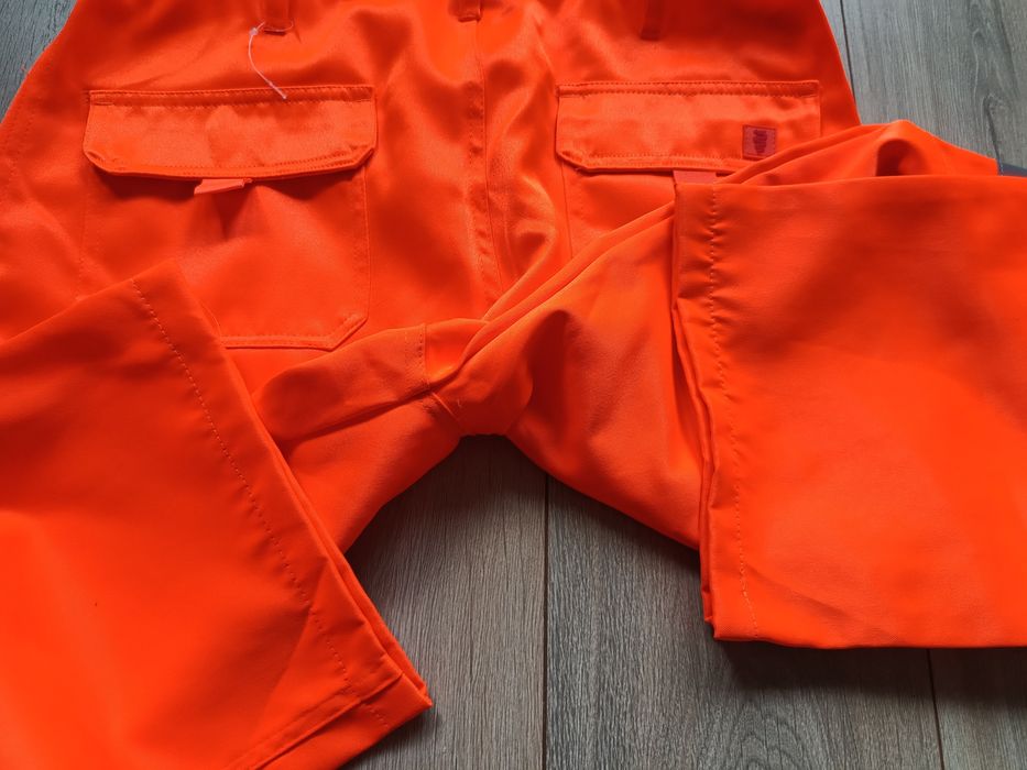 Męskie spodnie robocze pomarańczowe odblaskowe jak nowe Warrior