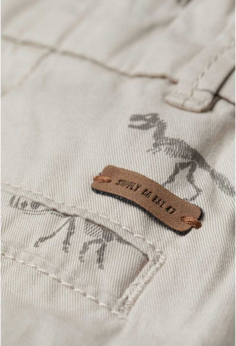 Calções/bermudas menino chino bege estampado dinossauros "H&M"