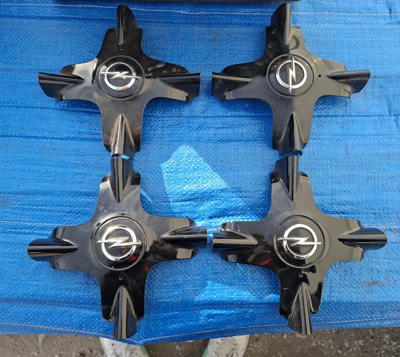 Orginalne dekle do felg aluminiowych Opel Corsa E Astra J Adam
