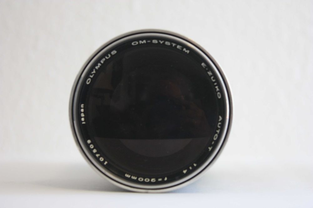 Objectiva Olympus OM, 200 mm, com estojo.