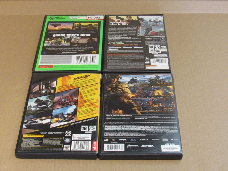 Lote 4 caixas de jogos de PC GTA Call of Duty Driver