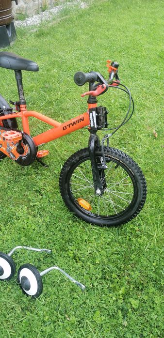 Rower Btwin pomarańczowy, hol rowerowy trail gator, kółka