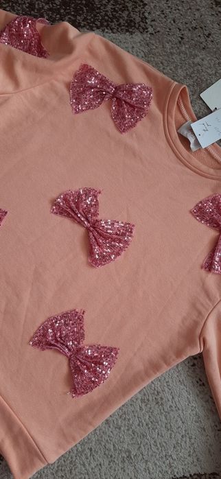 Bluza z cekinowymi kokardami rozm. Xxl