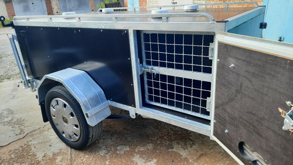 Прицеп , причіп для перевозки собак.
