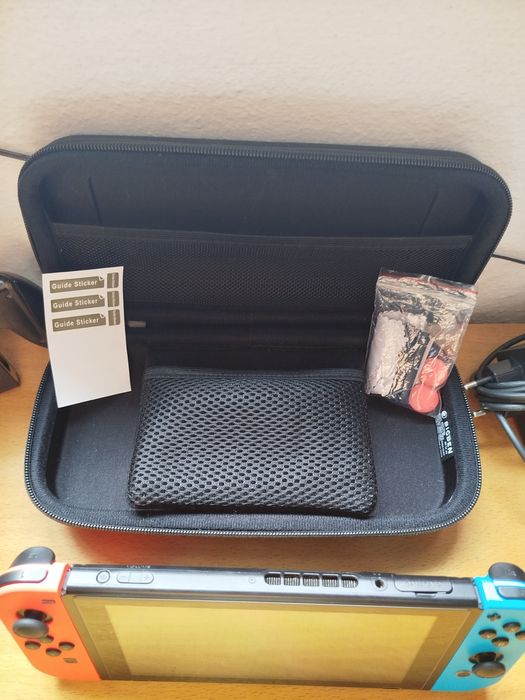 Nintendo Switch Complete with 4 Games and Carrying Case64551764677635123