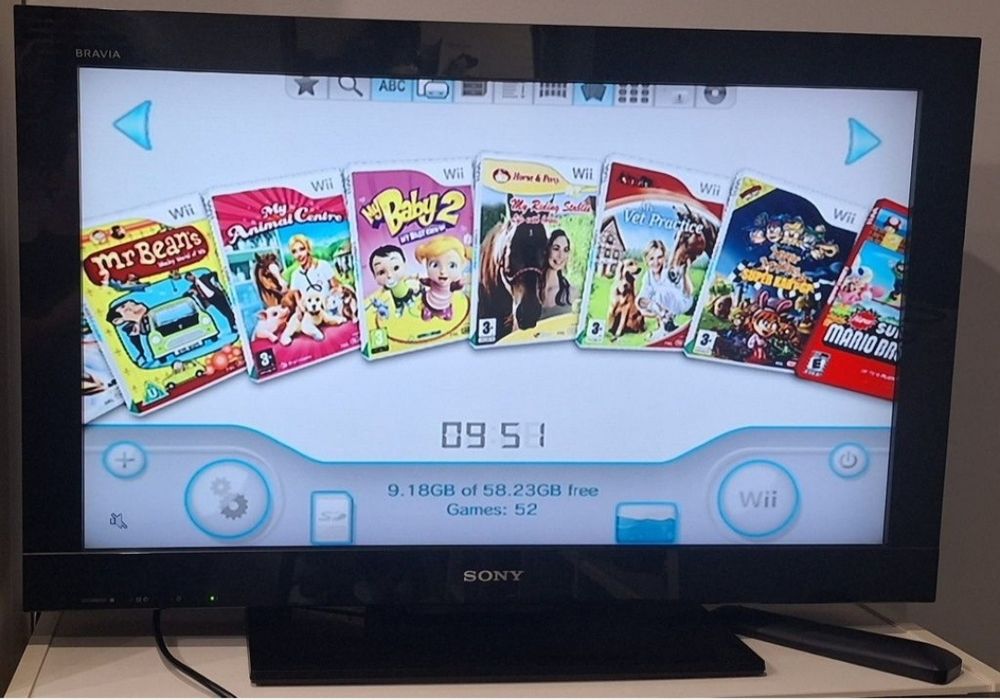 Nintendo Wii preta com 52 jogos digitais.