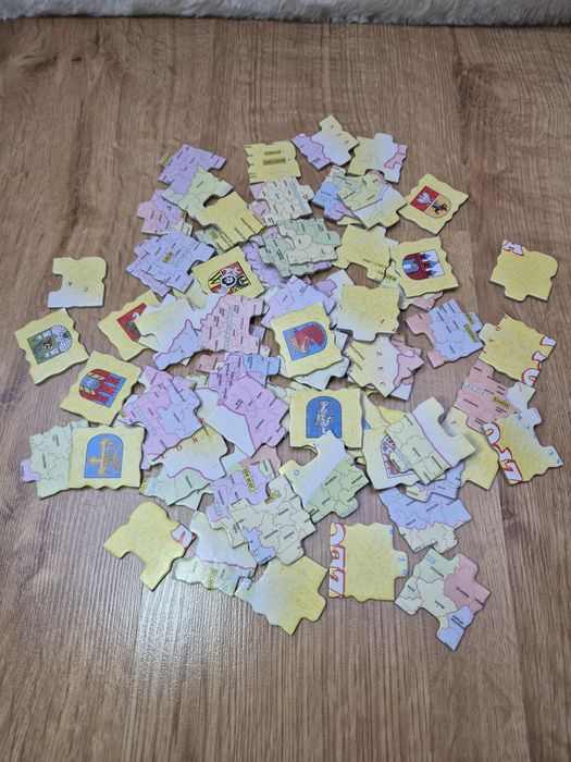 Puzzle mapa Polski z herbami miast