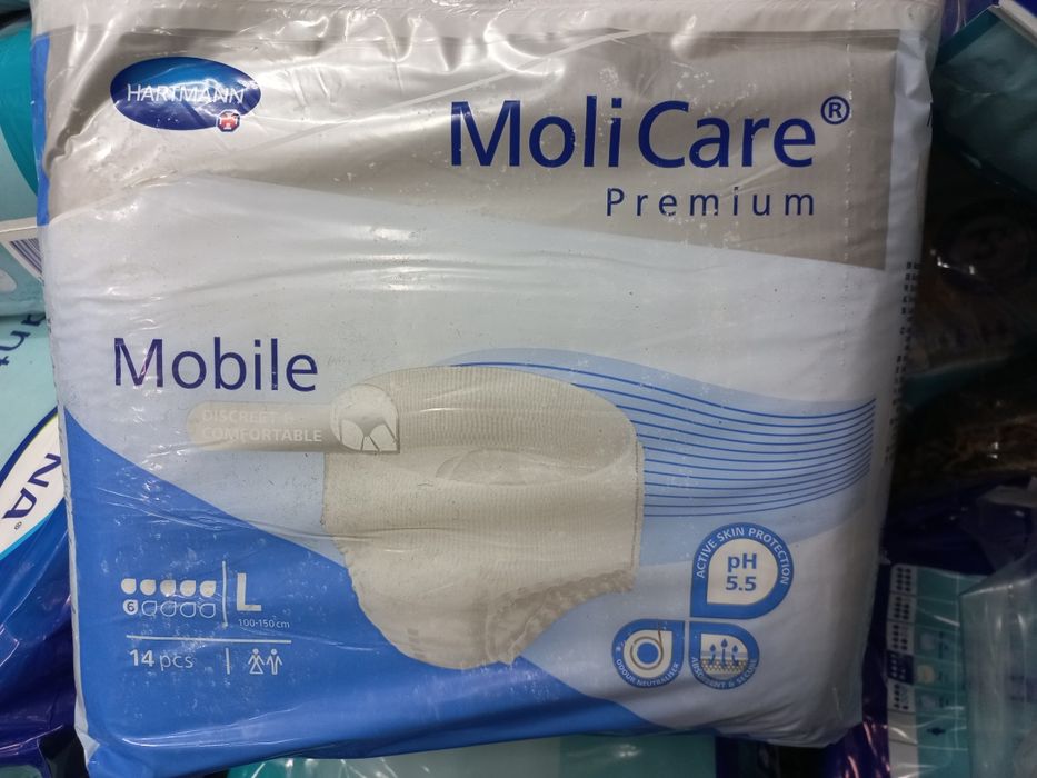 Продам два вида подгузников для взрослых .