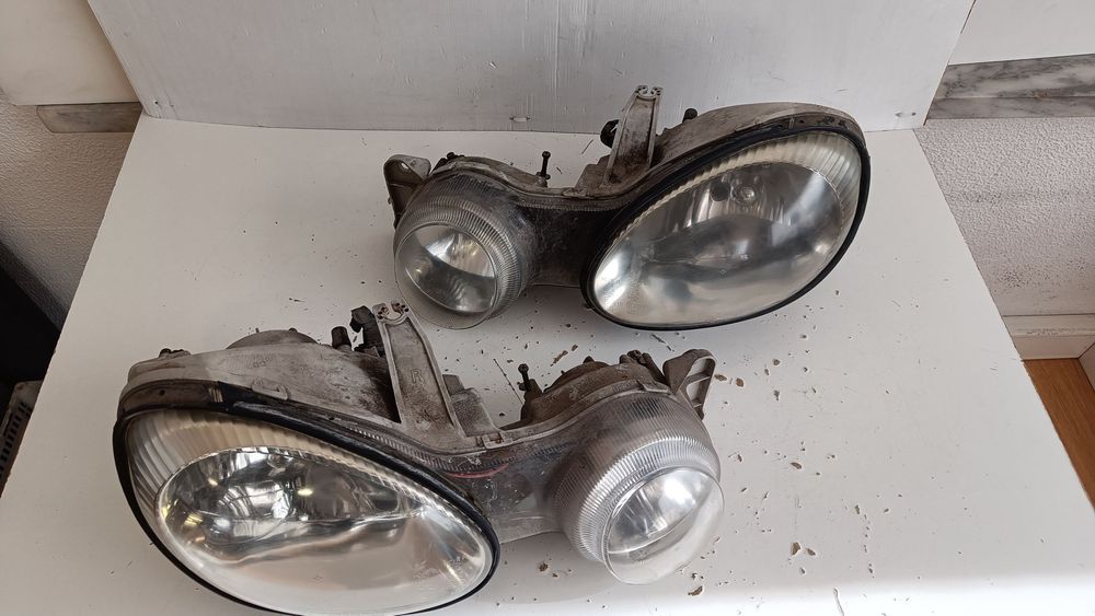 farol óptica Kia shuma 2000