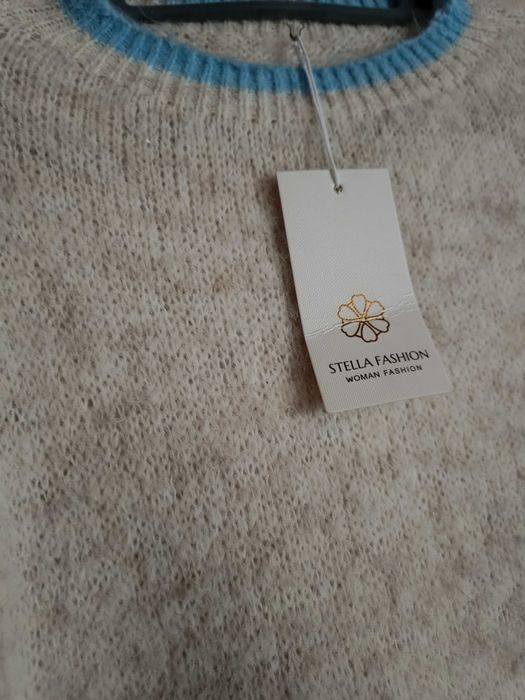 Nowy piękny  mięciutki Sweterek