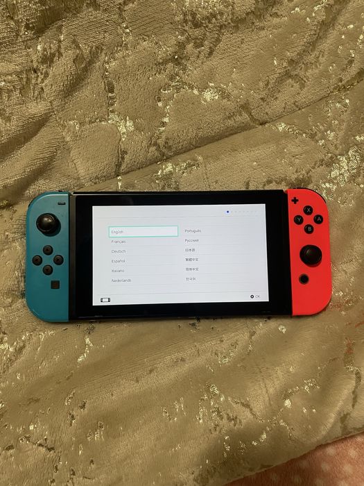 Nintendo Switch V2, 2 comando,2 jogos e bolsa de transporte