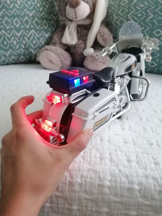 Brinquedo mota de polícia com som e luzes