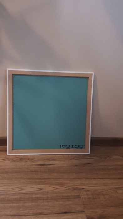 Lustro w białej ramie 45 cm. × 45 cm.