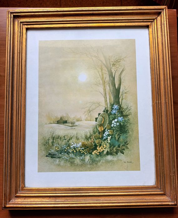 Quadro com moldura dourada