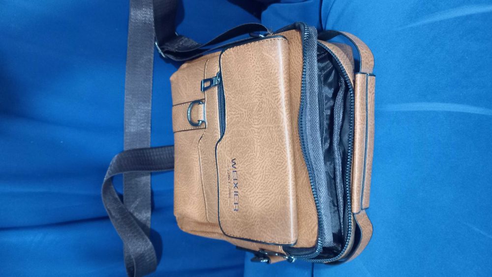 Mochila tira colo pele