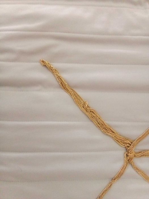 Bordão de metal dourado
