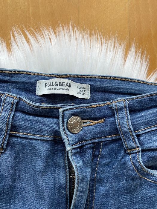 Spodnie damskie jeansowe pull&bear z dziurami skinny