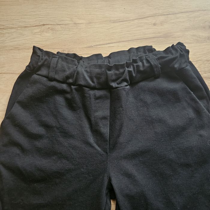 Spodnie czarne eleganckie,wysoki stan rozm.44. jak nowe.