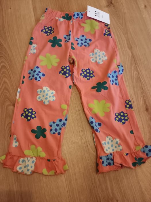 Spodnie dziewczęce dzianinowe w kwiatki - flary