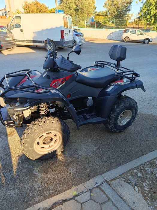 Vendo moto 4x4 com pouco uso e km