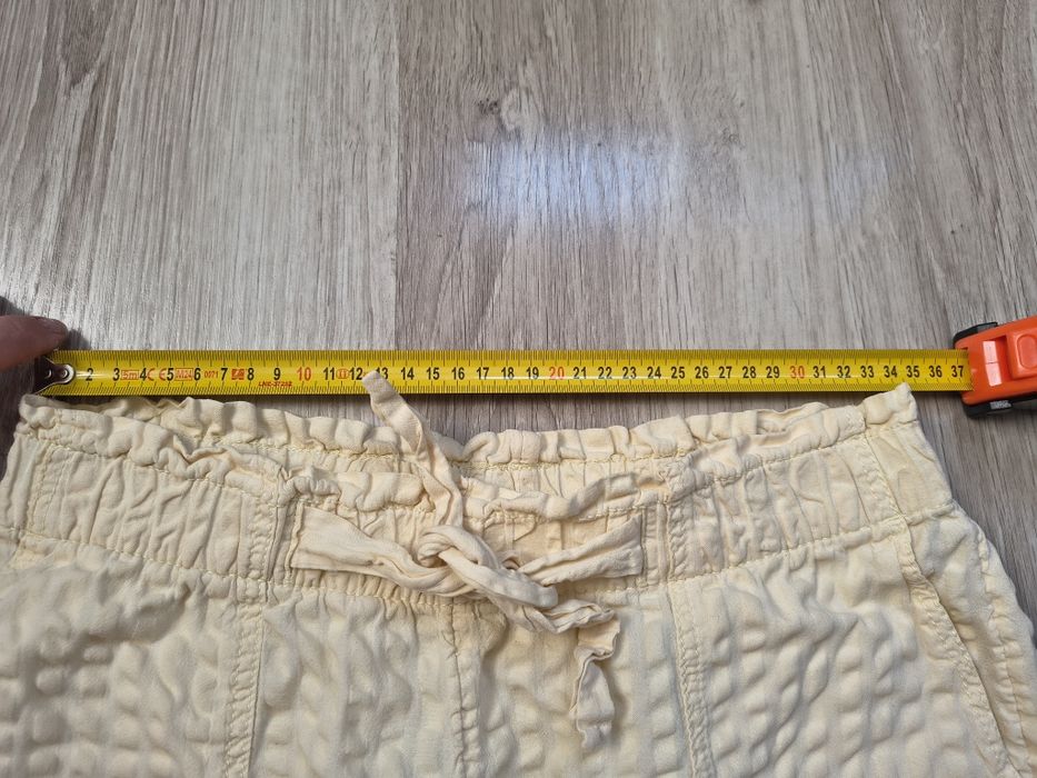 Żółte - pastelowe bawełniane spodenki 12-14 lat H&M