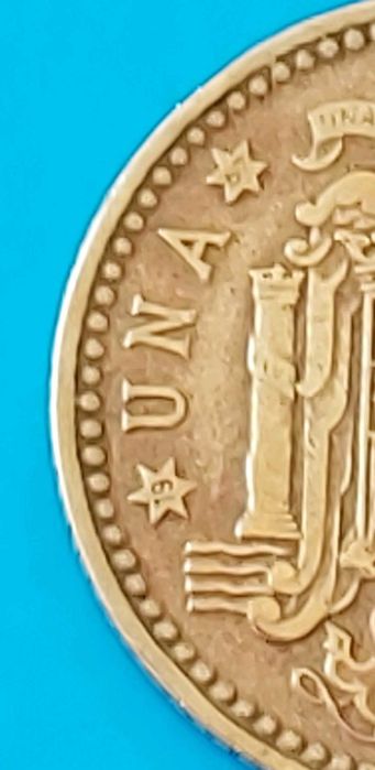 Una Peseta de 1966 com *67* na estrela, Espanha